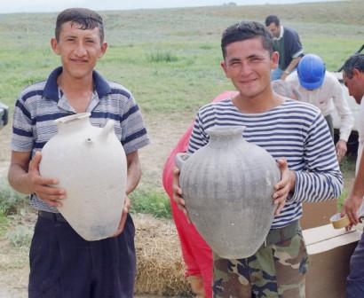 Rafig showing pottery vessels from the Zayamchai Bronze Age Cemetery excavation, Azerbaijan 2003